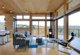 The cozy, birch plywood lined interior lets in views in all weather. The simple built-in ladder leads to a discreet hatch that opens for rooftop access.
