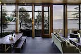 Steel windows and Brazilian slate balance warm wood ceilings, timber columns, and fir door frames.
