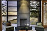 Concrete panels add visual weight to the fireplaces.