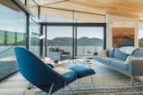 The interior can be arranged in a number of ways, including as a living and dining space to enjoy the water in any weather.