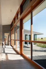 Floor-to-ceiling windows offer a view out to the “Big Sky,” with a gaze that skims over the hayfields.