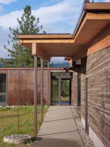 The roof overhang protects the entry walkway from heavy winter snow.