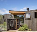 Board and batten cedar siding takes a note from the agrarian region.