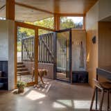 Clerestory windows on the southern facade mitigate intense summer sun while keeping the spaces bright.