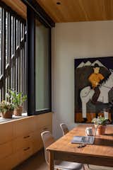 The cedar wood screen tempers sunlight at the interior workroom.