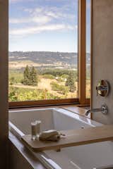 Large surrounding windows give a sense of being outdoors even from the comfort of the bathtub.