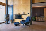 Living Room, Concrete Floor, Chair, Recessed Lighting, and Wood Burning Fireplace  Photo 7 of 19 in Copper Harbor by Prentiss + Balance + Wickline Architects