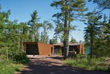 Exterior, House Building Type, Metal Roof Material, Metal Siding Material, and Shed RoofLine The house is made up of two main volumes, formed by metal shells which extend toward the water.  Photo 2 of 19 in Copper Harbor by Prentiss + Balance + Wickline Architects