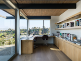 The architects reimagined the office with white oak cabinetry and new shelving.