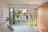 Brian specified a large window and built-in storage for the primary bedroom, which opens to a deck beneath a three-foot overhang. "The bedroom isn't massive, but it feels really gracious,