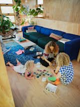 A sectional by Hay has replaced what Lizz once described as their "one-hundred-dollar, thrift-store leather couch." It’s paired with Project Room’s MOCA Mirrored Bench and a CB2 rug. The couple found the LC4 chaise lounge at an estate sale. 
