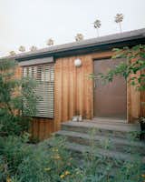 Redwood siding lends organic texture to the exterior of architect Richard Stampton's Los Angeles home. "We wanted to slowly gain some presence in the community and not get into the swing," Richard says of the conversion of an existing 1920s bungalow on the site. "It was a more sensitive approach that was necessary in a neighborhood where people had lived for a long time."