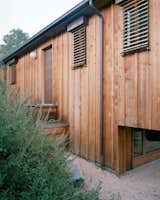As he did at his home in Australia, Richard used external motorized blinds to keep the house cool in the summer. A new window brings light into the lower level office.