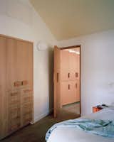 Inspired by the Finnish architect and critic Juhani Palasmao and his book Eyes of the Skin: Architecture and the Senses, Richard designed rectangular Douglas fir door handles for the second bedroom and other spaces in the house. "Handles are a simple, everyday opportunity to invoke a softer and warmer transition between ourselves and the house," Richard explains. "The underside is hand shaped to provide an intermediate pull angle and a generous wood surface for the fingertips."