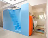 The ADU kitchen is outfitted with a SMEG refrigerator  and an LG washer and dryer.