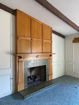 The original living room featured wall-to-wall carpeting and a popcorn ceiling. “We found a stash of $2 bills in the old fireplace,” recalls Kim. “I don’t know what they were saving them for, but it felt like good luck.”