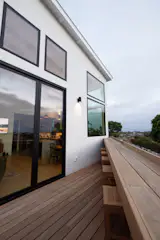 By strategically positioning the deck, Geis provided outdoor seating off the living area for gatherings. Since the space required a Class A fire-rated material, Sarah and Brant chose red balau wood for less than the cost of ipe.