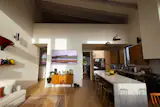 Though it's not large in size, the living-dining area and kitchen feels larger because of the high ceilings. "They go from 14 feet on the low side to 18 feet on the high side,