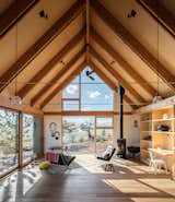 Designed to capture the character of traditional wooden cabins within a contemporary framework, this family residence in Fairplay, Colorado, is comprised of two volumes linked by an outdoor deck.