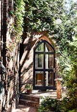 The embraced original character details of the church, including the arched glass doorway to the tower. When homeowner Jennifer and Grant initially viewed the space, the tower "was just the icing on the cake.