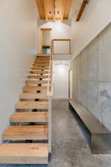 The interior stair is composed of floating treads sourced from trees cut down on the property. A mix of oak, maple, and birch, each step is different and unique.