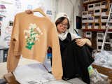 Culk master of operations Bee Beardsley shows off the Daisy Women’s Cropped Crewneck Sweatshirt featuring artwork by San Francisco artist Jen Kindell.&nbsp;