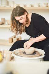 "It’s so exciting to create pieces that are not only aesthetic, but functional—objects that become an intimate part of everyday rituals and the spaces they inhabit," says owner Julia Lemke, pictured above at work in the Earthen studio.