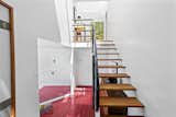 A staircase with Douglas fir treads leads to the second floor.