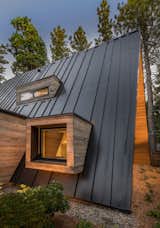 A cubic cantilevered window sits three feet off the ground, while the "eyebrow" dormer punctures the guest bedroom.&nbsp;