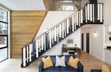 The home’s stair is the singular element in the home that has a radius. With gently curved steel stringers, and a guardrail composed of irregularly sized painted wood pieces, the stair becomes a focal point, and is an element of whimsy interrupting the clean lines of the home. 