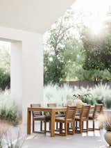 The Batten Extendable Teak Outdoor Dining Table features sustainably-sourced, FSC®-certified natural teak, and an optional leaf that can increase seating capacity from eight to ten. 