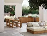 The horizontal lines of Batten’s seating collection offer visual contrast to the verticality of the kitchen’s teak slats.  Photo 1 of 760 in Taos by stephen mullens from Crate & Barrel’s New Modular Kitchens Bring a Custom Look Outdoors