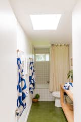 "I fell in love with a green cement tile from Concrete Collaborative when we were starting to talk about the bathrooms," says Leah of the brand’s Laguna tile in the lichen color, which covers the guest bathroom’s floor. "From there, we kept everything pretty minimal, letting the tile be the focal point."