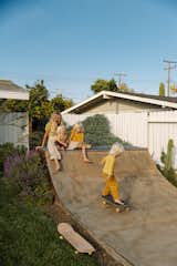 When neighbors were getting rid of an old half pipe, Leah and Jakeh scooped it up, creating a skate ramp for their three kids in the front yard of the Costa Mesa, California, midcentury they renovated. "We bordered it with plants to make it feel like it was always there," says Leah.