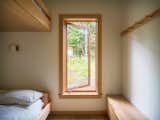 A cozy bunk room incorporates an E-Series Casement Window from Andersen.