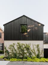 The use of Nakamoto Forestry’s shou sugi ban siding over brick is a nod to the home’s original facade, while evoking the materiality of Japanese architecture.