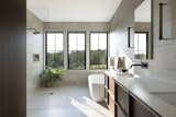 The serene primary bath features Andersen 100 Series windows, made of durable Fibrex. "This allowed us to place the windows in a wet environment without concern," Angaran says. 