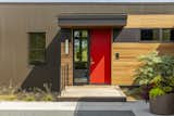 The home’s exterior materiality is a tapestry of corrugated metal, cedar, and brick.