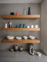 Floating cherry shelves showcase display-worthy kitchenware.