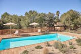 After replastering the pool, Leah and Kyle planned on pouring concrete around the pool deck—but pivoted when they decided the outdoor space needed more texture, deciding instead to run the wood deck seamlessly to the water’s edge.