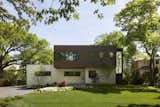 A Clever Wood Alternative Helps This Contemporary Home Blend Into Its Surroundings