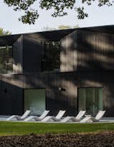 "I would describe the charred exterior as ‘blacker-than-black,’ as it seems to absorb all light striking it," says Lucy of the home’s striking siding from Nakamoto Forestry. "The texture is unique and dramatic while still maintaining a connection to nature and sustainable materials." Nakamoto Forestry uses logs from their sustainably planted and harvested forests in Japan.&nbsp;