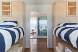 Bunk room with oculus deck and ocean beyond