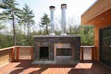 Ipe roof deck with outdoor fireplace and stone surround
