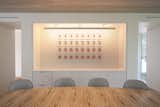 A Corian Sleeve in the Dining Area Makes the Artwork Focal
