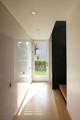 A Glass Door in the Stair Hall Brings in Daylight
