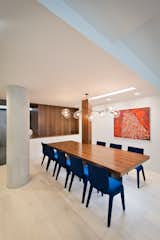 A Careful Lighting Composition as the Dining Table Helps Define Space