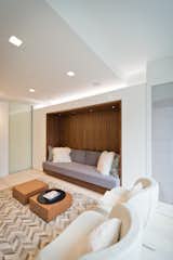 A Linear Light Above the TV Room Sofa Niche Elevates the Space