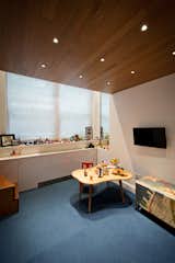 Emphasizing the Concept of a Millwork Insertion, Wood Ceilings are Carried Through