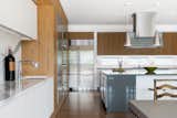 Open Kitchen with Large Island and Custom Teak Cabinetry